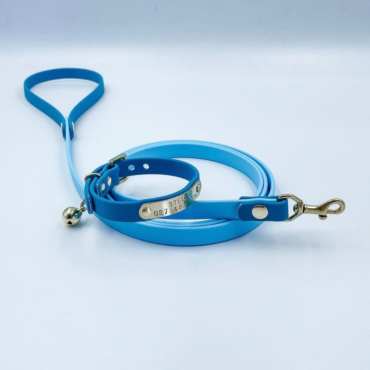 Lagoon blue BioThane cat collar and lead showing its 1.5 metre finished length and lightweight brass clip.