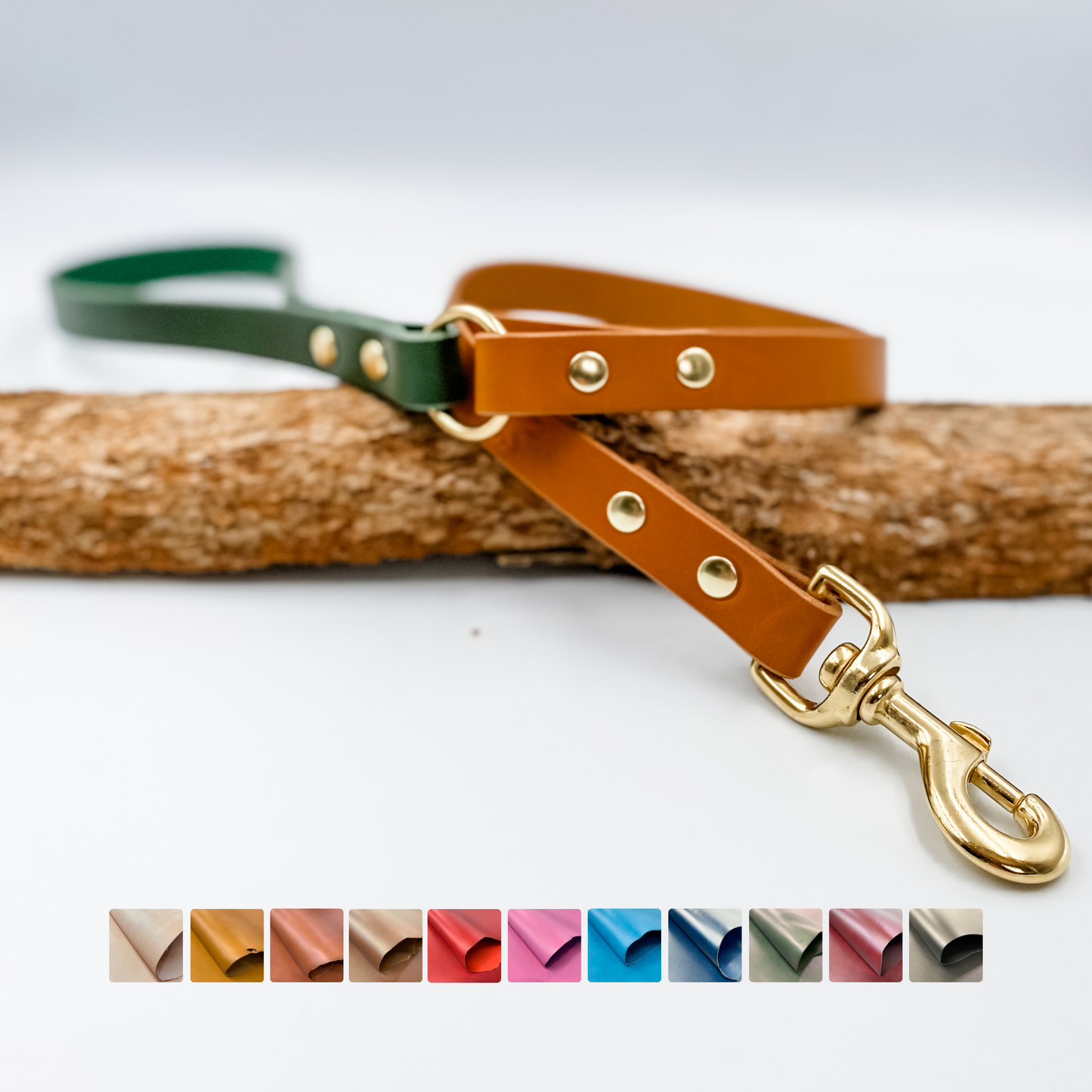 A two-tone custom dog lead with a flat design, featuring a brass fastener and handle. The lead is showcased in two colors: green and brown.