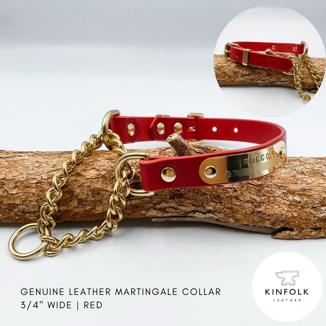 Red leather martingale collar with gold brass chain and Kinfolk Leather branding on a wooden log.
