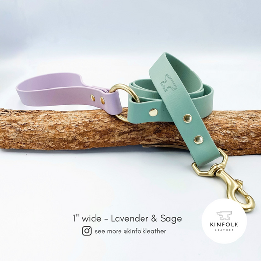 Two-tone dog leash in sage green and lavender on a white background, with Kinfolk Leather branding.
