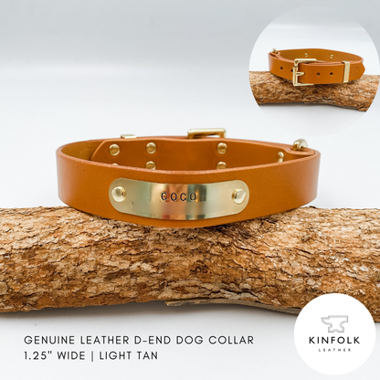 Light tan leather dog collar with gold D-end on a wooden branch, featuring the brand 'KINFOLK LEATHER'.