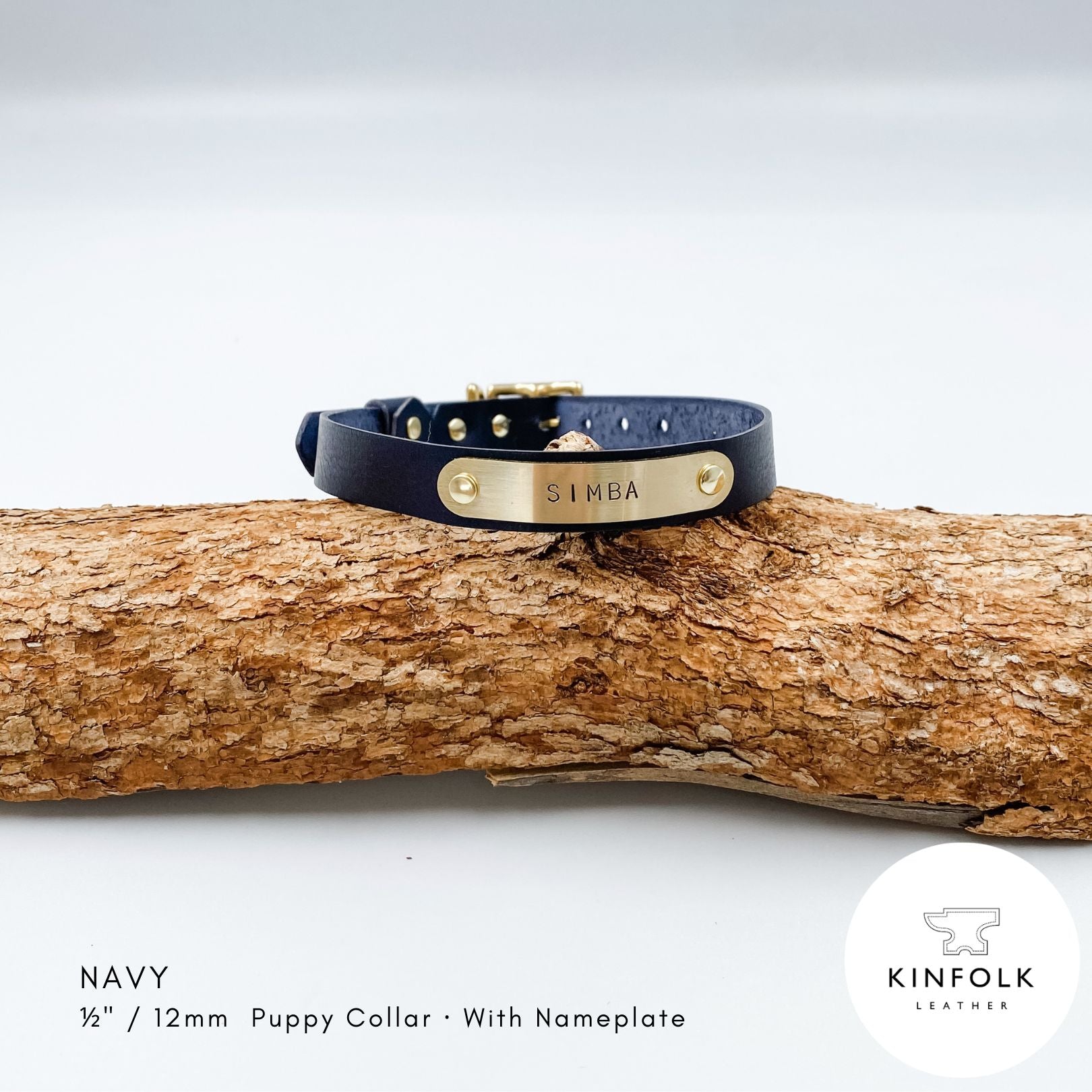 Navy blue leather puppy collar with personalised brass nameplate