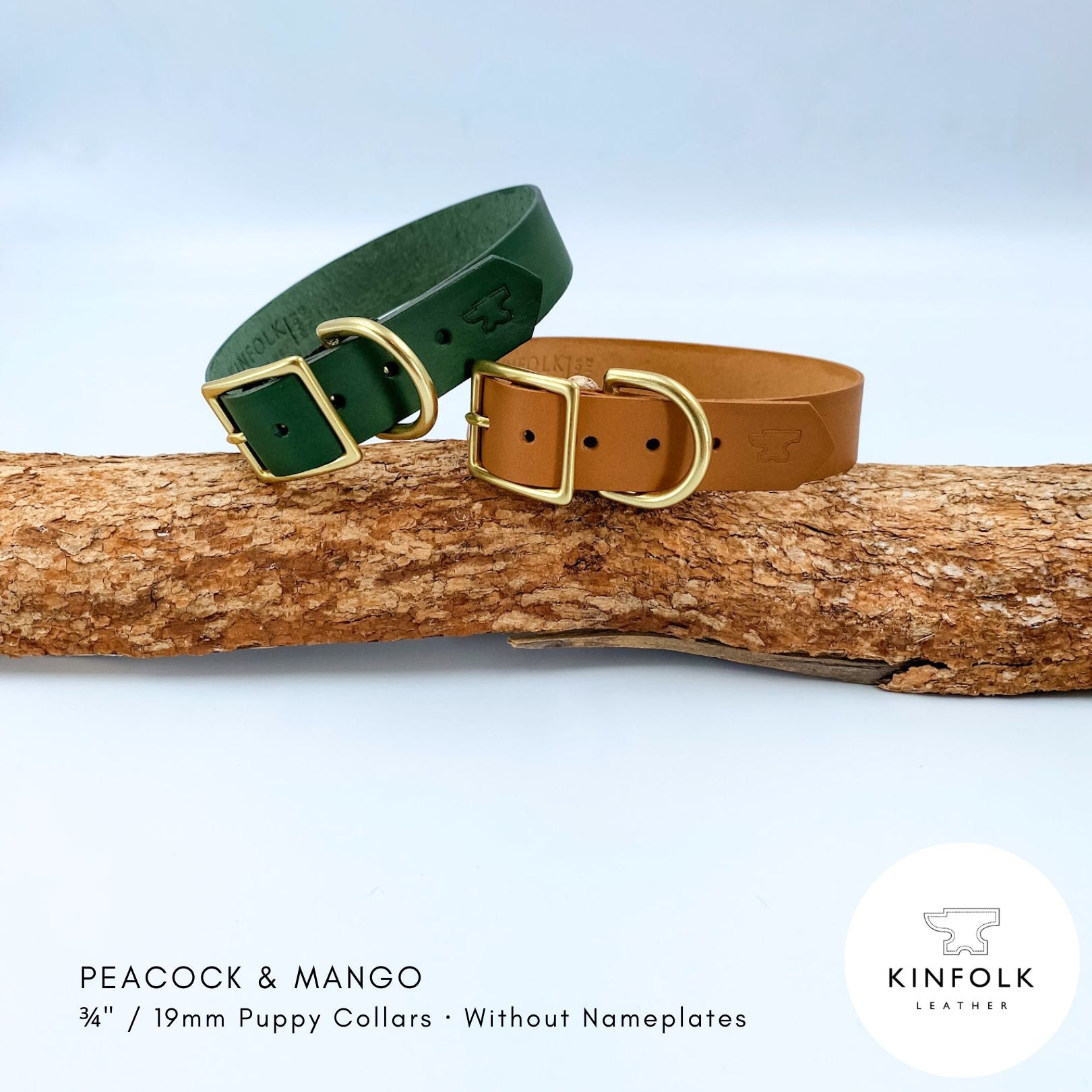 Two leather puppy collars, one dark green and one tan, displayed on a piece of wood with brass buckles. The image includes text identifying the colors as 'PEACOCK & MANGO' and a 'KINFOLK LEATHER' logo in the bottom right corner.